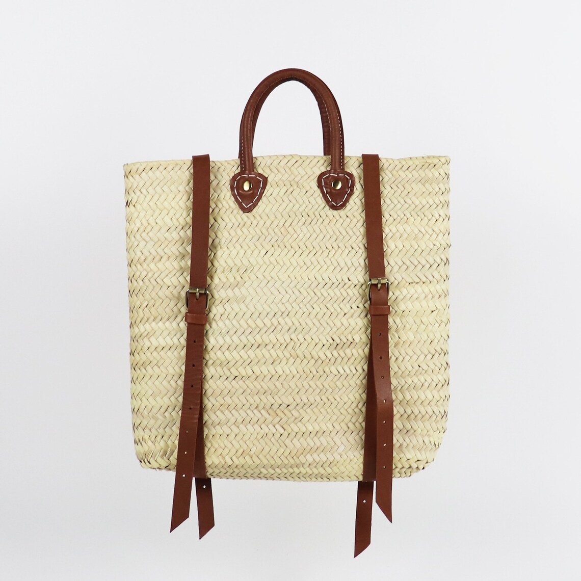 straw backpack with leather straps